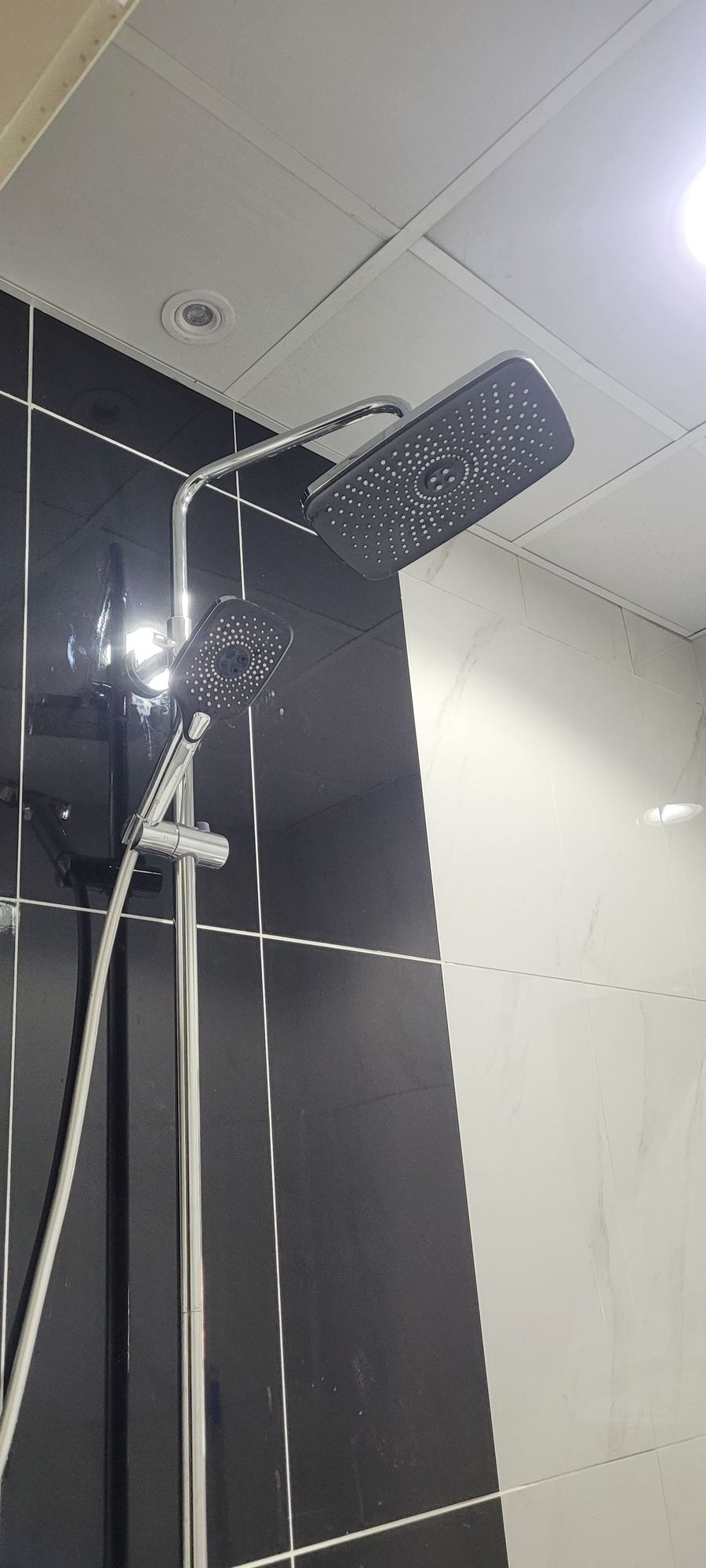 Completed bathroom with new shower and sink installation